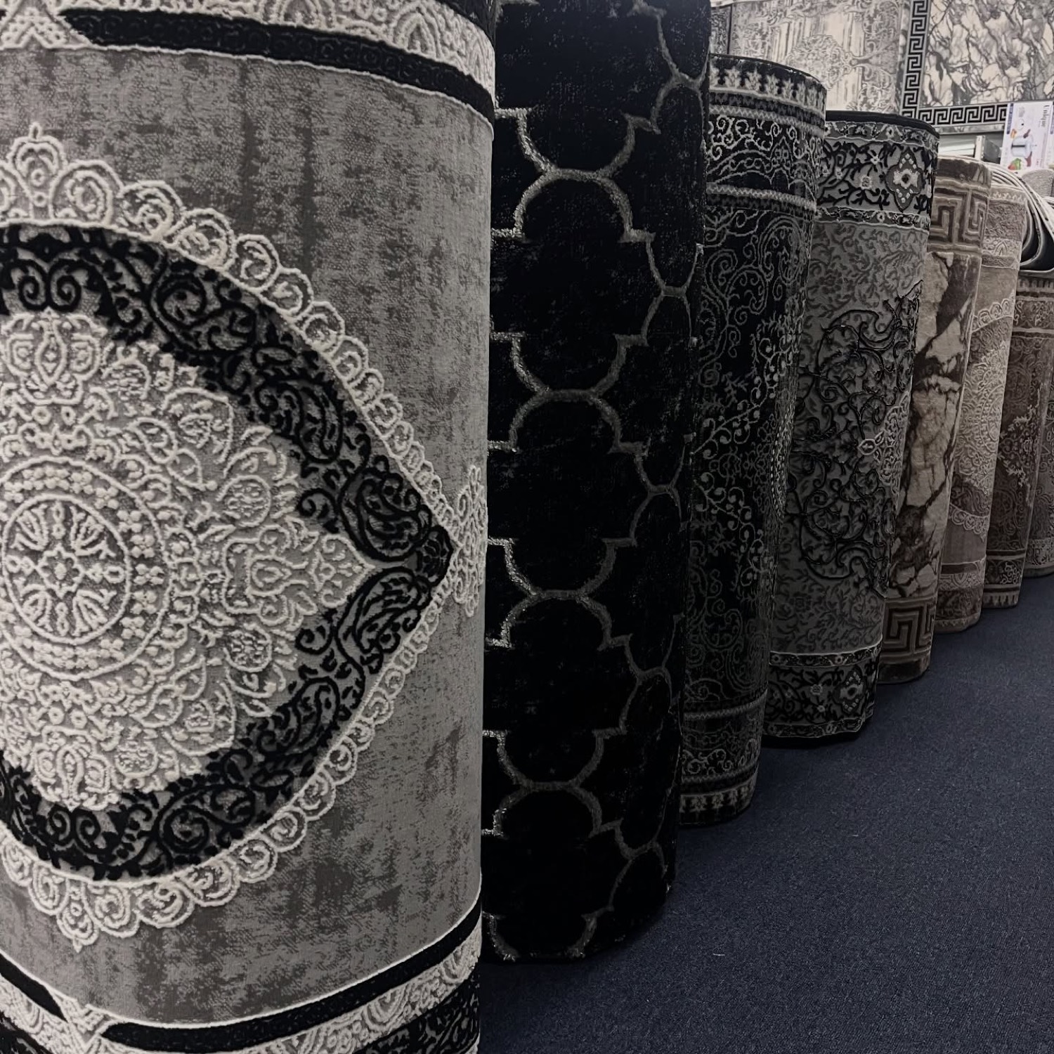 Rolled hallway runners standing in the showroom
