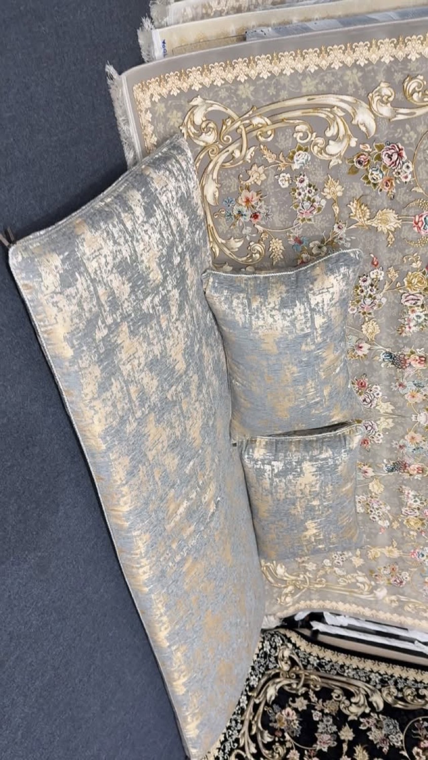 Velvet toshak cushions in blue and gold on ornate rugs