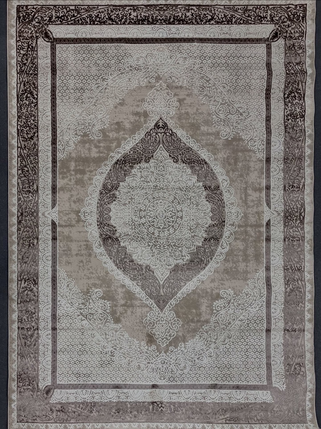 Turkish rug with ornate brown and cream medallion